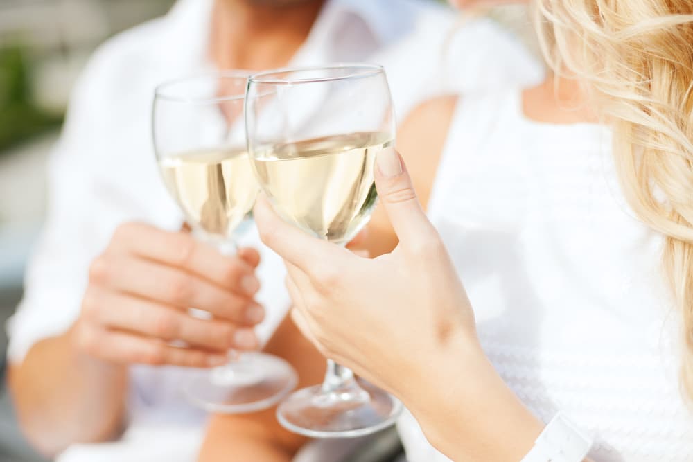 Where to Spend Your Pennsylvania Weekend Getaways 4 couple enjoying white wine on their Pennsylvania Weekend Getaways