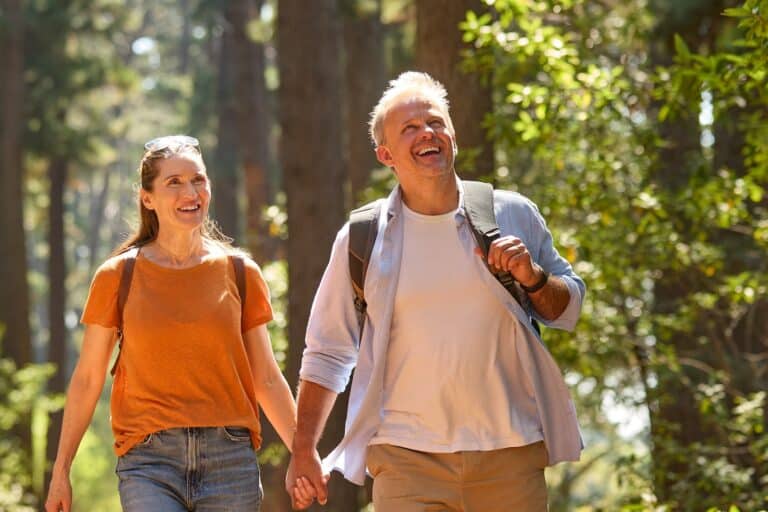 Senior Retired Couple Holding Hands Hiking, one of the best things to do in Pennsylvania for couples this year