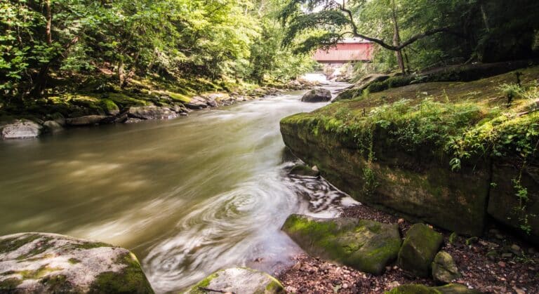 McConnells Mill State Park, a covered bridge off in the distance over a river